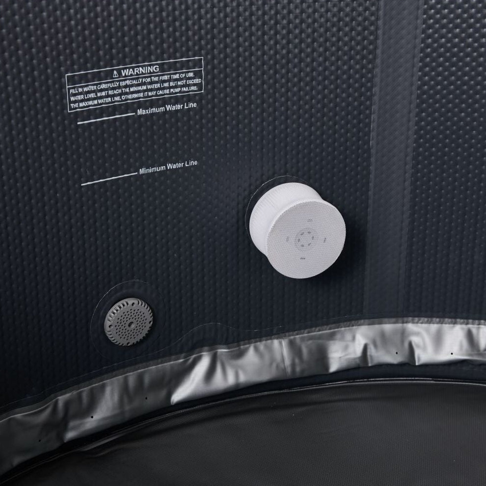 Close-up of dark gray textured inflatable hot tub wall with white circular control knob and a smaller round vent near the. - Home Interior Shop - MSpa Mono Eco 4-6 Person Inflatable Hot Tub
