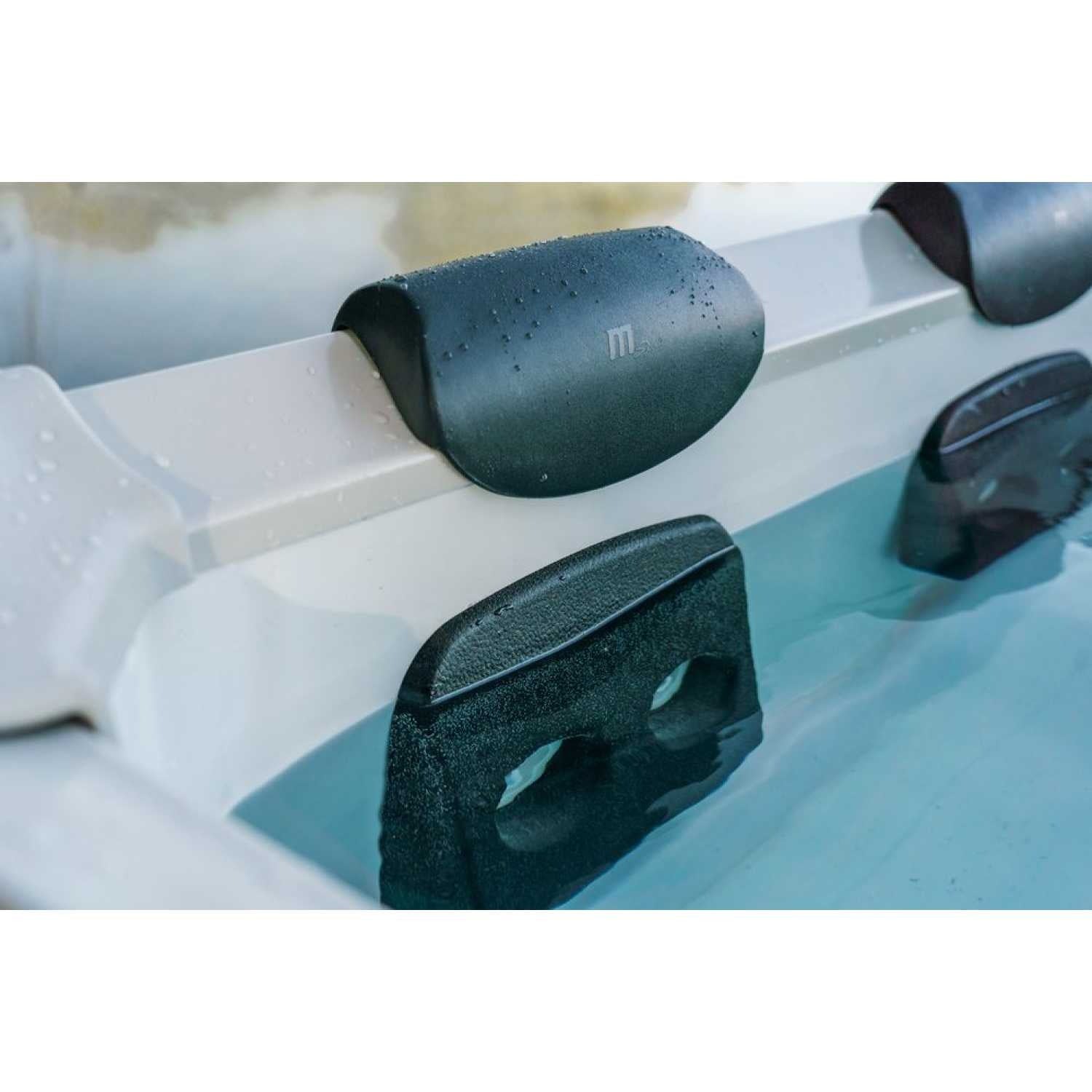 Close-up of grey MSpa Oslo Plus XL hot tub featuring adjustable black headrests and built-in seat supports in clear blue. - Home Interior Shop - MSpa Oslo Plus XL Portable Hard Frame Hot Tub - Grey