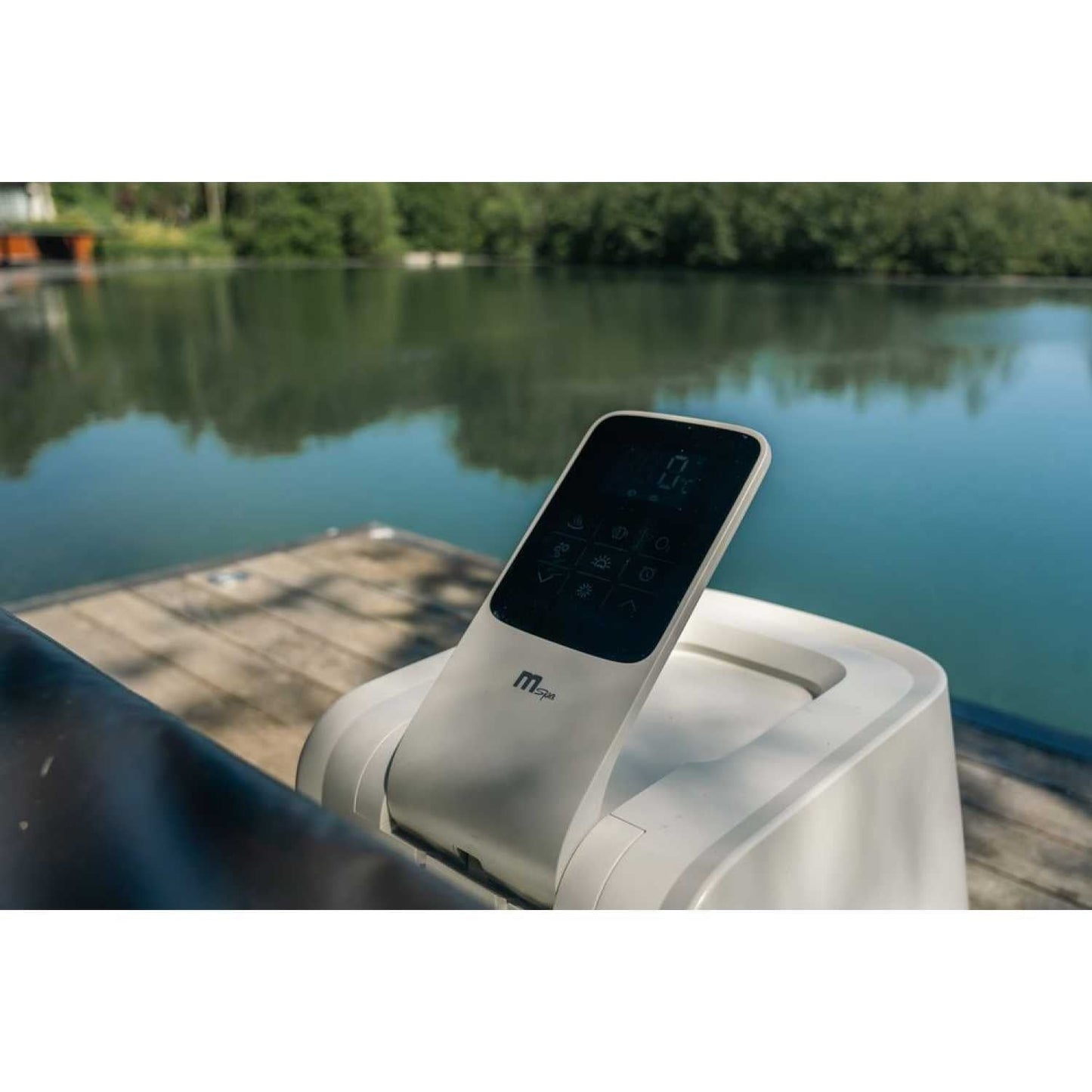 Square grey portable hard frame hot tub with digital control panel on the edge, set outdoors by calm water and trees in. - Home Interior Shop - MSpa Oslo Plus XL Portable Hard Frame Hot Tub - Grey
