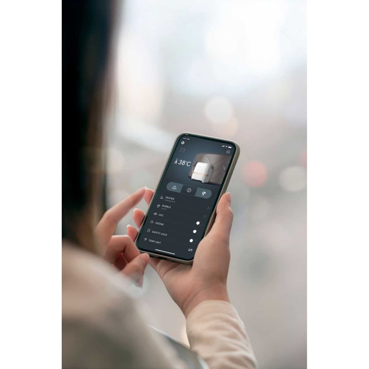 Hand holding smartphone displaying MSpa hot tub control app with temperature and settings on screen. - Home Interior Shop - MSpa Oslo Plus XL Portable Hard Frame Hot Tub - Grey