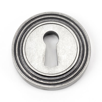 From The Anvil Round Escutcheon