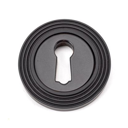 From The Anvil Round Escutcheon
