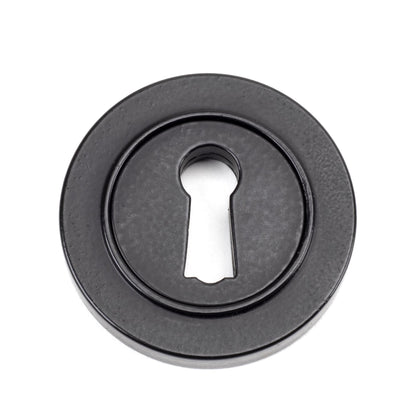 From The Anvil Round Escutcheon