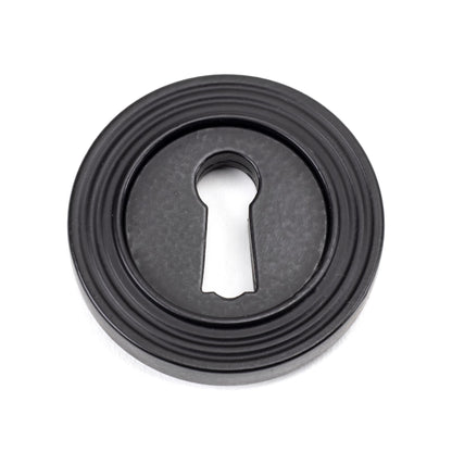 From The Anvil Round Escutcheon