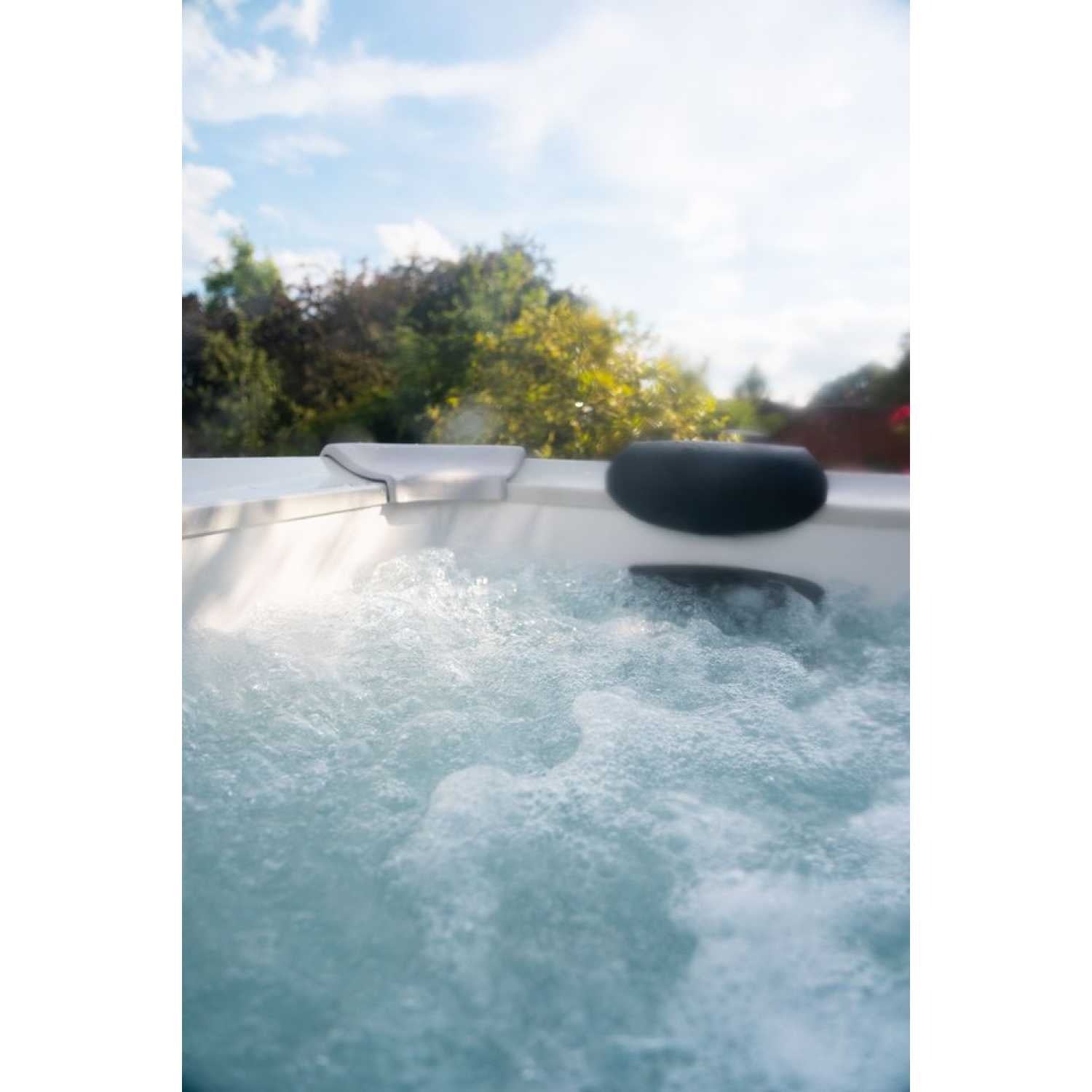 Gray portable hard frame hot tub with bubbling water and two black headrests, outdoor setting with trees in background. - Home Interior Shop - MSpa Oslo Plus XL Portable Hard Frame Hot Tub - Grey