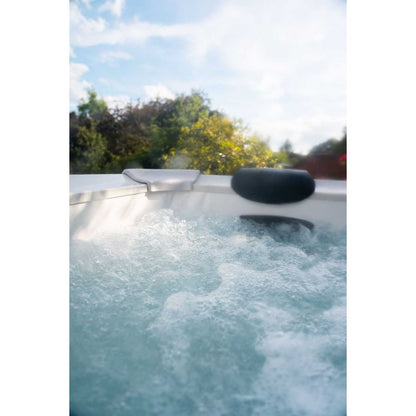 Gray portable hard frame hot tub with bubbling water and two black headrests, outdoor setting with trees in background. - Home Interior Shop - MSpa Oslo Plus XL Portable Hard Frame Hot Tub - Grey